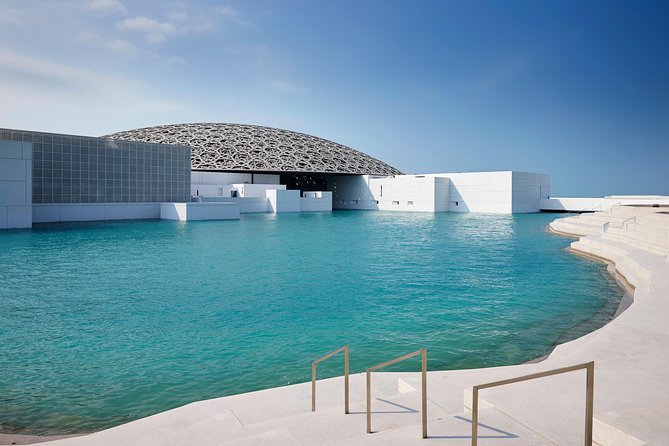 From Dubai: Abu Dhabi Day Tour with Grand Mosque & Louvre Museum - Etihad Towers, Emirates Palace, and the Corniche: fast photo stops, not full visits