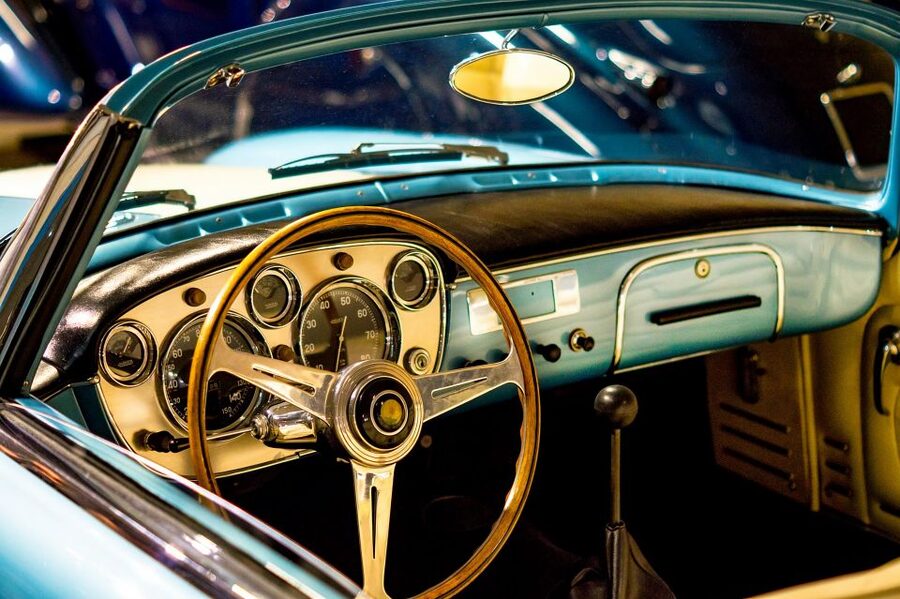 Malta Classic Car Collection Museum Entry Ticket - The information panels, restored presentation, and the workshop viewing window