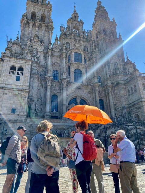 Santiago de Compostela: Cathedral, Museum, and Old Town Tour - Getting oriented at Plaza del Obradoiro (orange umbrella included)
